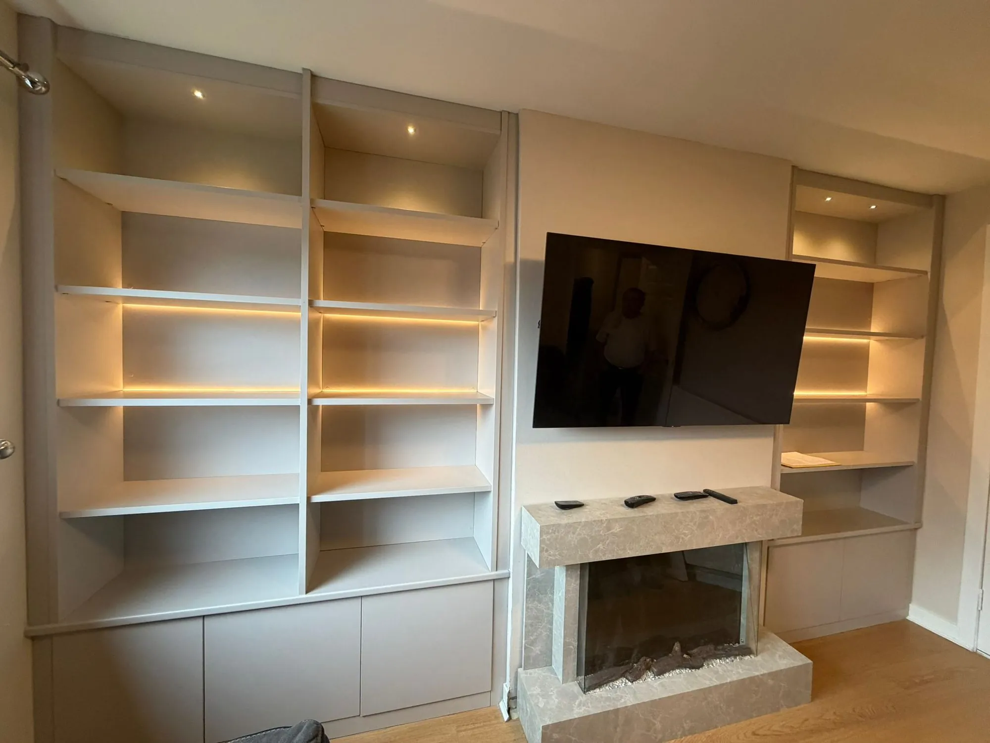 White media wall with shelving